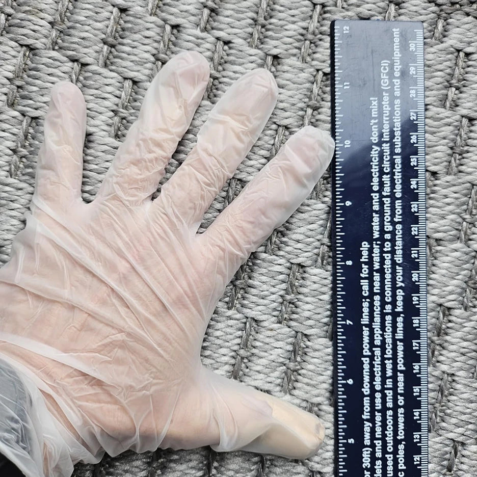 SureSafe Lucid 3.5 mil clear vinyl gloves, 100 count box, latex-free and powder-free for multipurpose professional use.